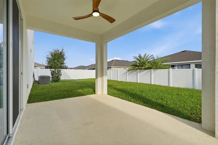Covered lanai with ceiling fan. Room for pool in the backyard