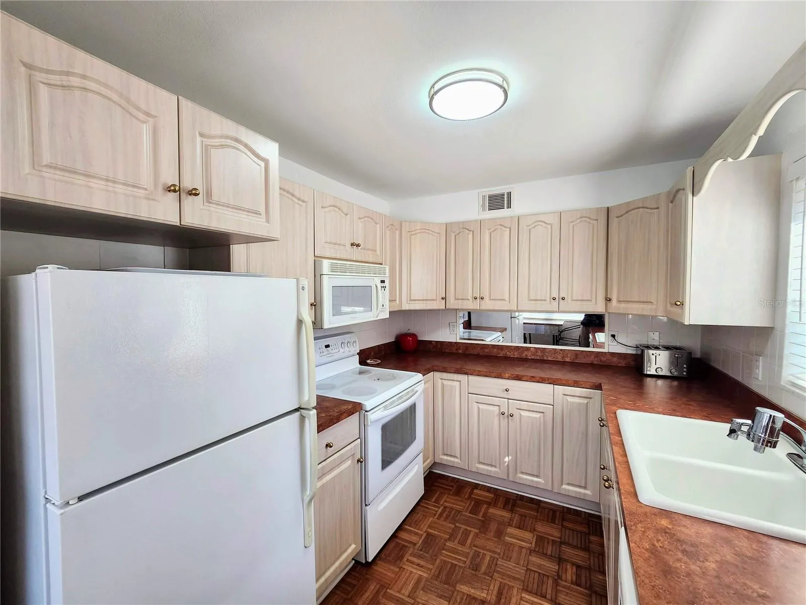 Ample cabinets, light & bright!
