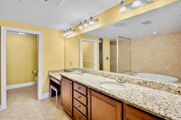 Primary bath with lots of storage, dual sinks and water closet.