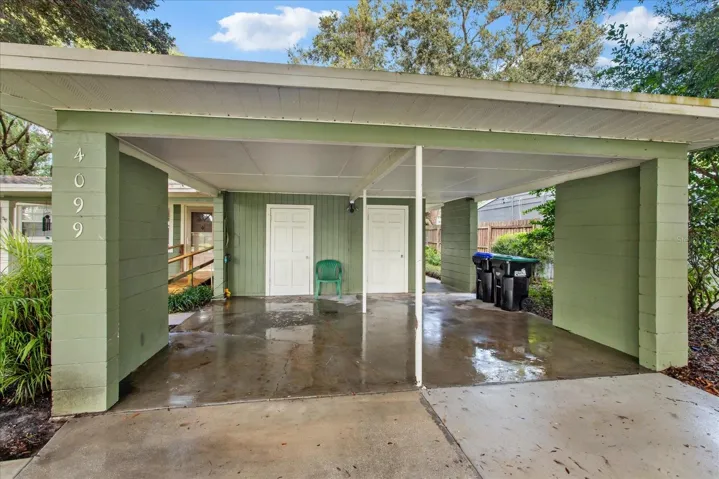 Carport (after a rinse) with two storage rooms.
