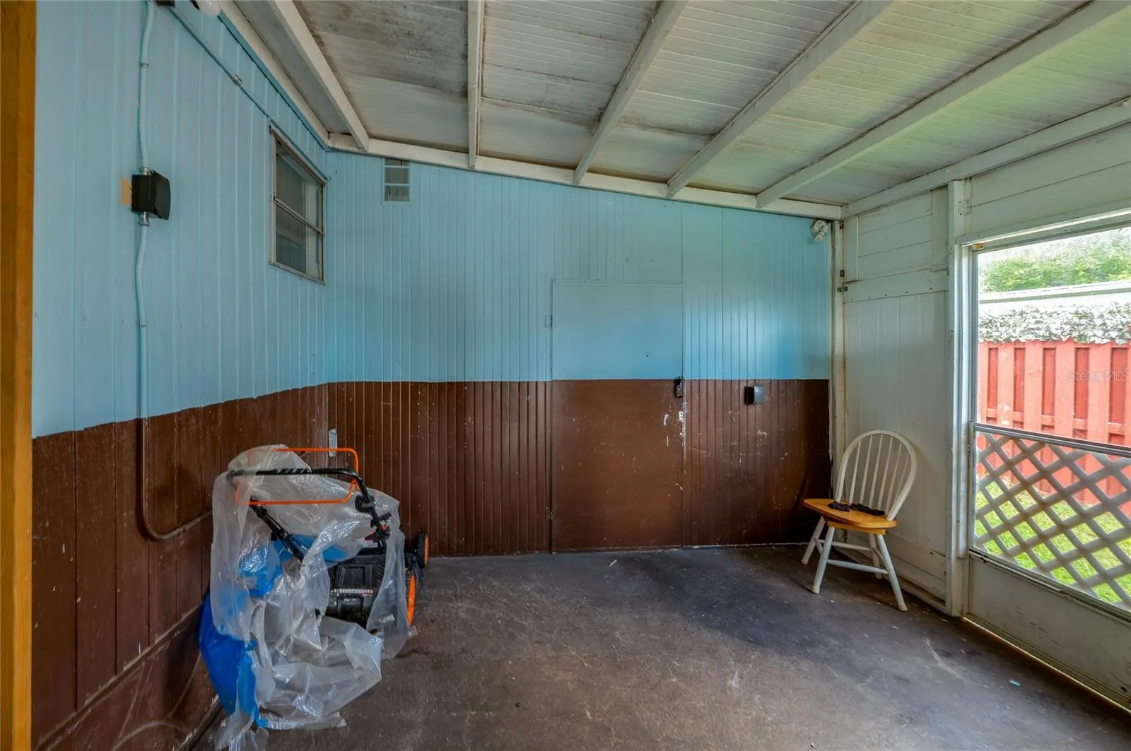 Additional view highlights the covered space and open side access, offering flexible room for outdoor seating, storage, or other uses.