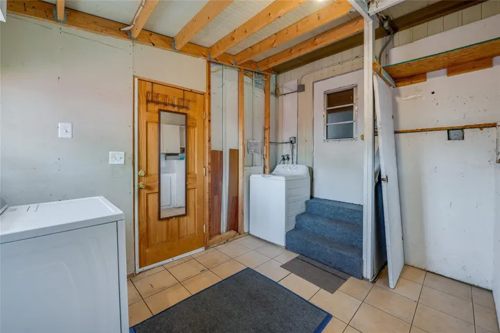 Separate laundry area provides space for laundry appliances along with additional room for household storage and utility needs.