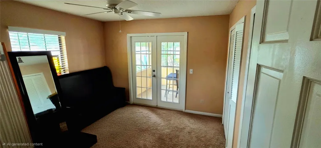 3rd bedroom with french doors to Florida room