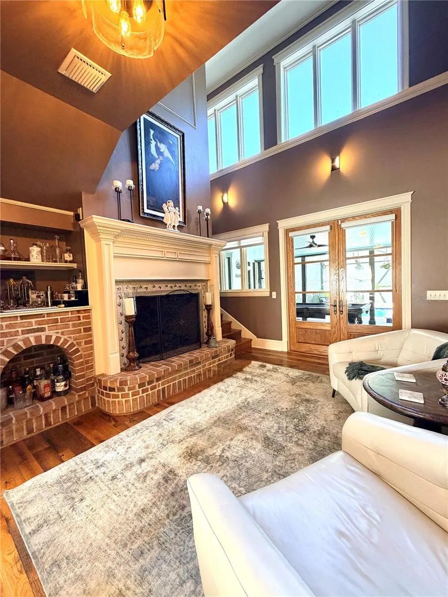 fireplace sitting room opens to the pool area
