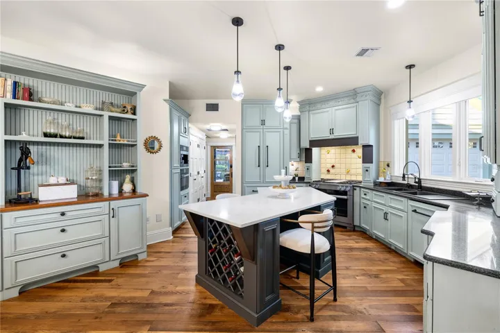 kitchen- custom built in refrigerator and dishwasher/ Miele dual fuel gas range with griddle and steaming/proofing connected