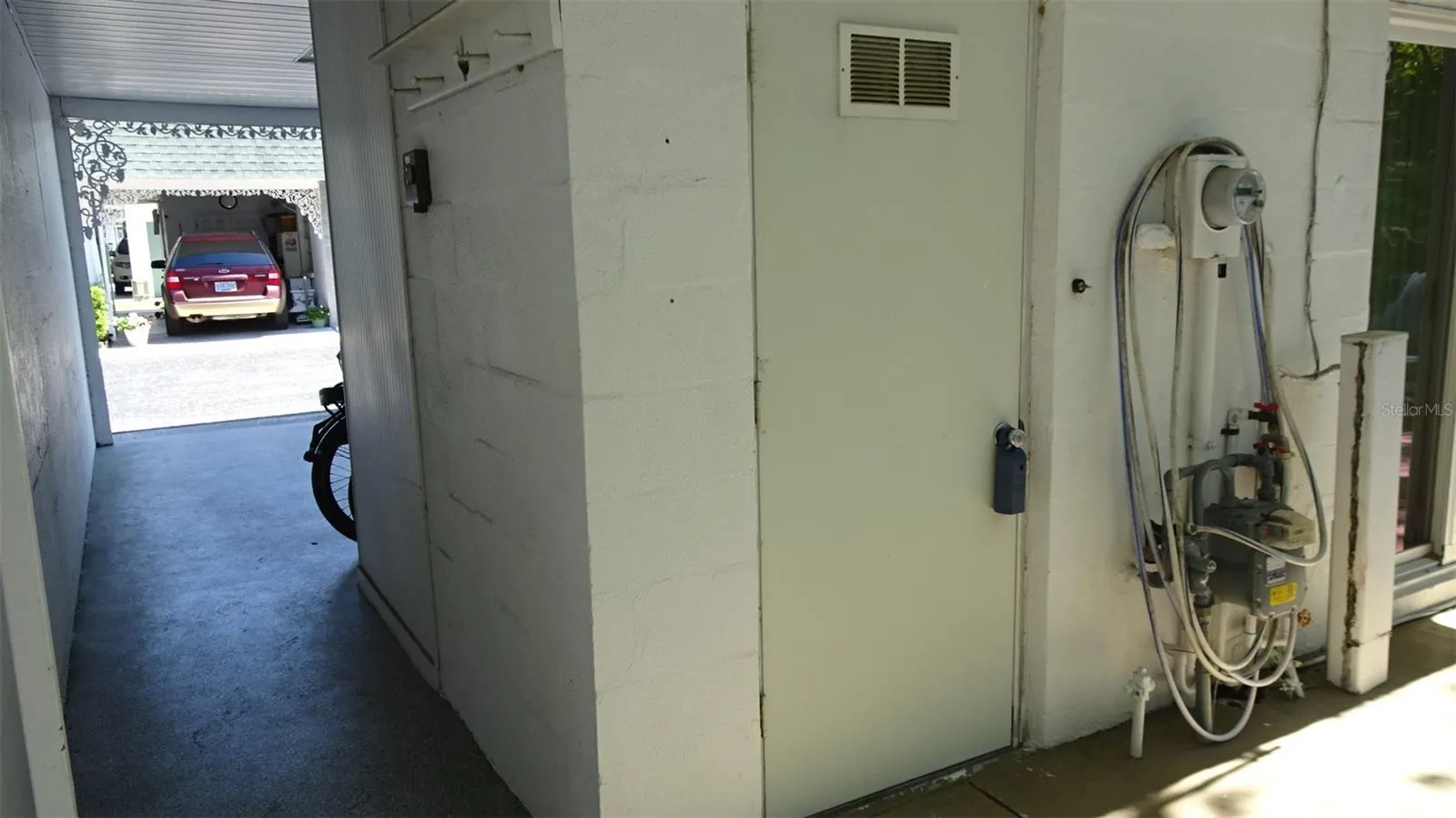 Laundry room behind the carport.