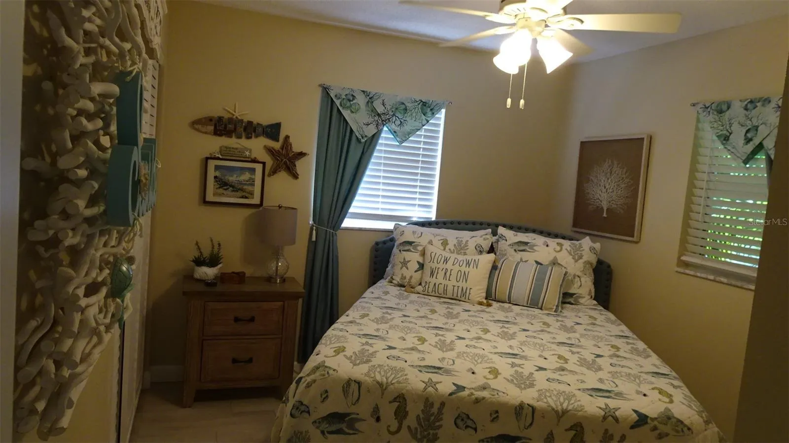 Rear bedroom bed as furnished by sellers.