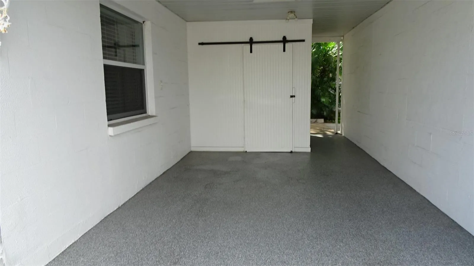 Private carport with storage.