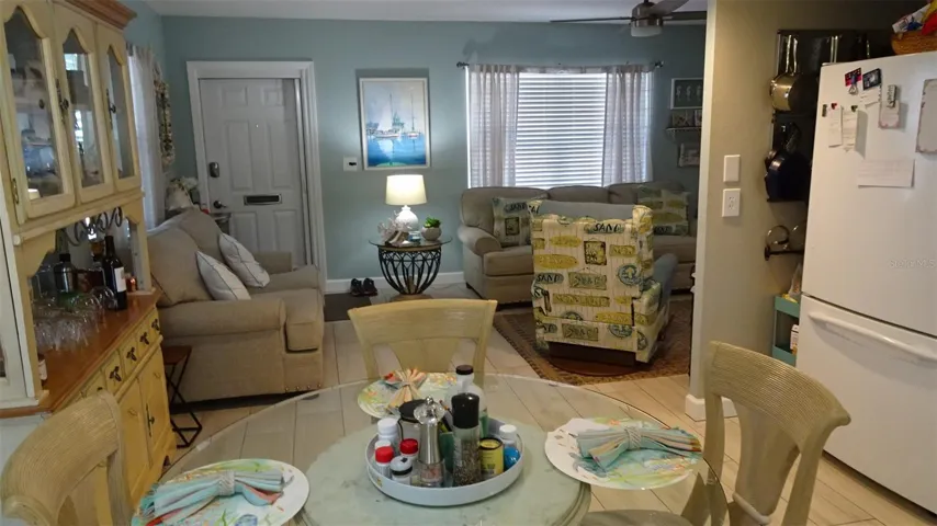 Dining room view into living room as furnished when sellers lived there.