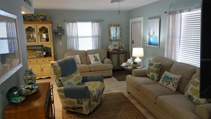 Living room furnished when sellers still lived there.