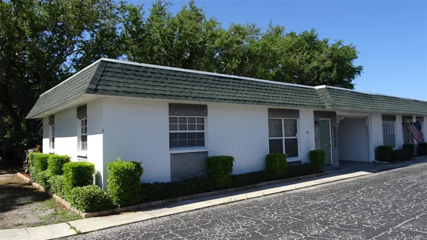 Private carport with guest parking just to the left of this villa