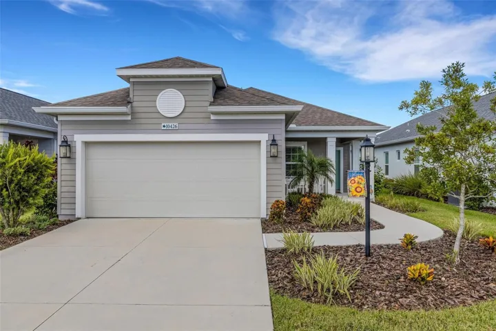 Welcome home to this beautifully maintained 2022 Neal Communities residence in Silverleaf, featuring an inviting exterior and attached two-car garage.