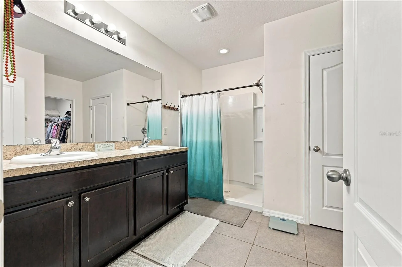 Primary bathroom with shower and 2-closets