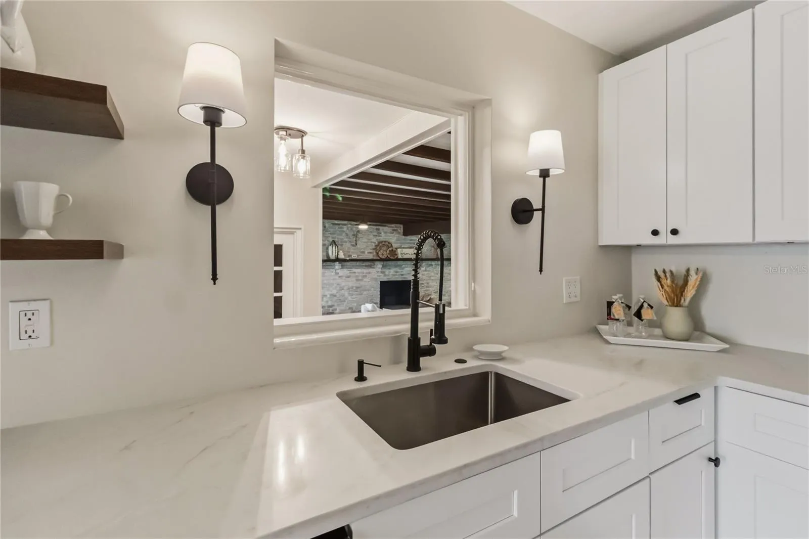 Kitchen overlooks Family room with pass thru