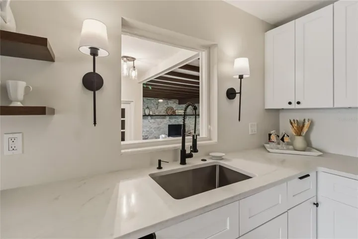 Kitchen overlooks Family room with pass thru