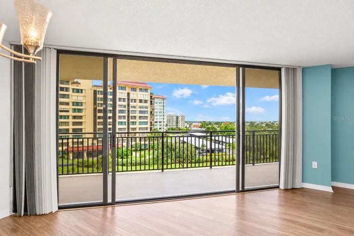 Large sliding doors from living/dining room. with easy close hurricane shutters