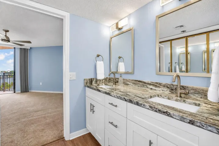 Updated primary bathroom with double vanity and closet remodel