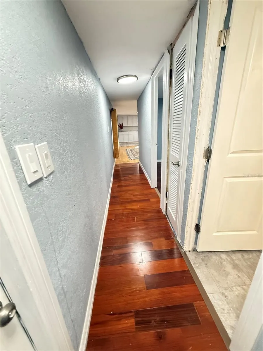 HALL TO BATHROOM AND BERROOMS