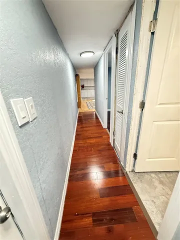 HALL TO BATHROOM AND BERROOMS