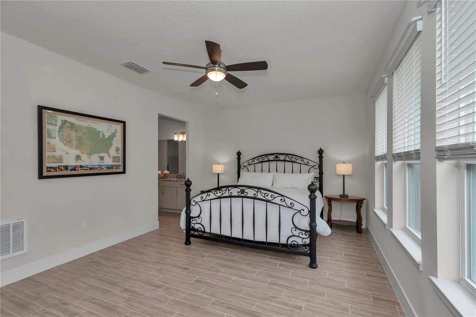Large primary suite with garden views