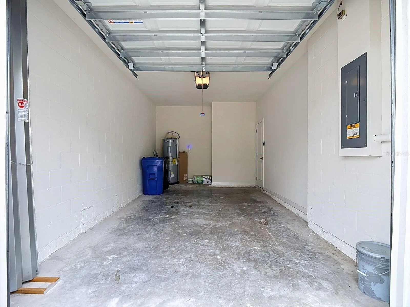 Hurricane panels are tucked inside the garage along with your trash and recycling cans