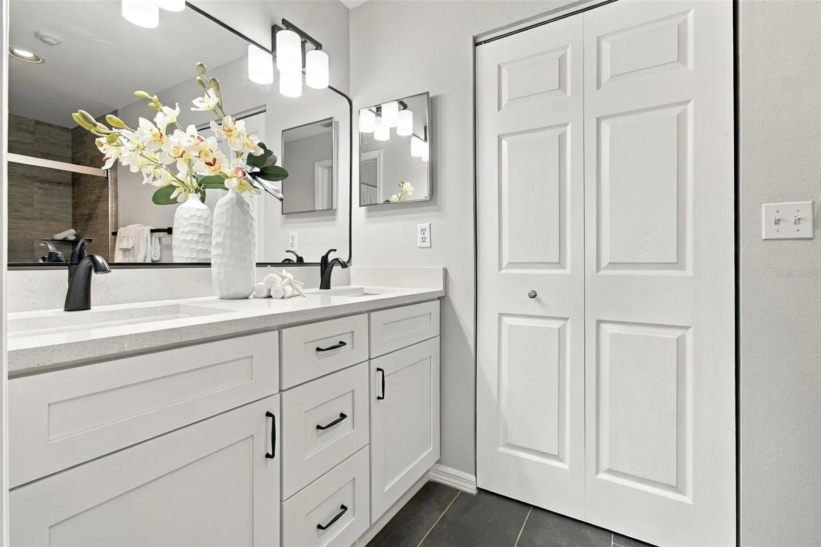 Quartz Countertops, New Fixtures in Black Matte, New Mirror. Linen Closet