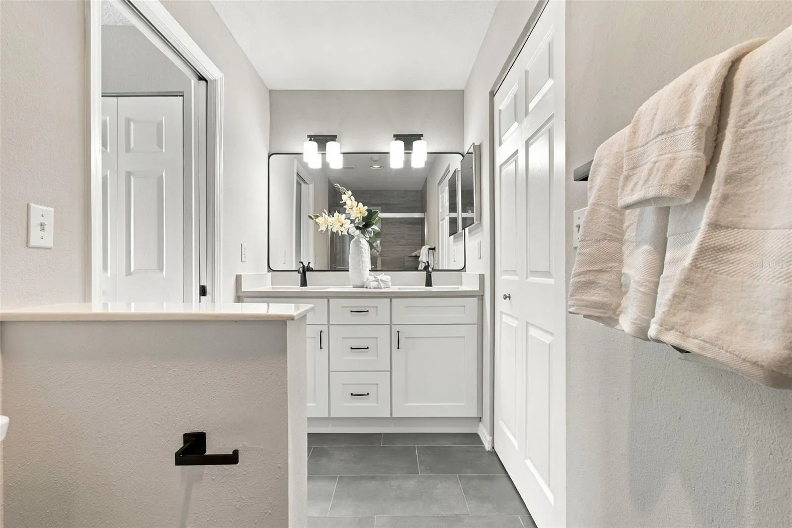 Tastefully updated Primary Bath w Custom Dual Vanity