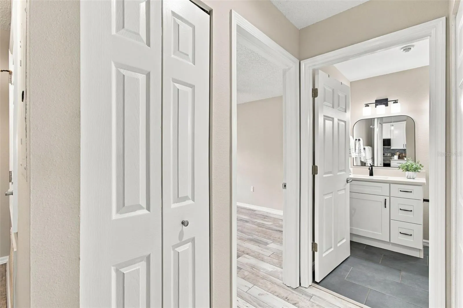Guest Bath w Custom Vanity w/a Peek into Secondary Bedroom