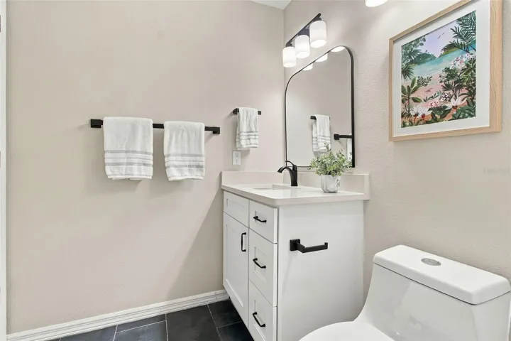 Quartz Countertop, New Faucet, MIrror, Light and Fixtures