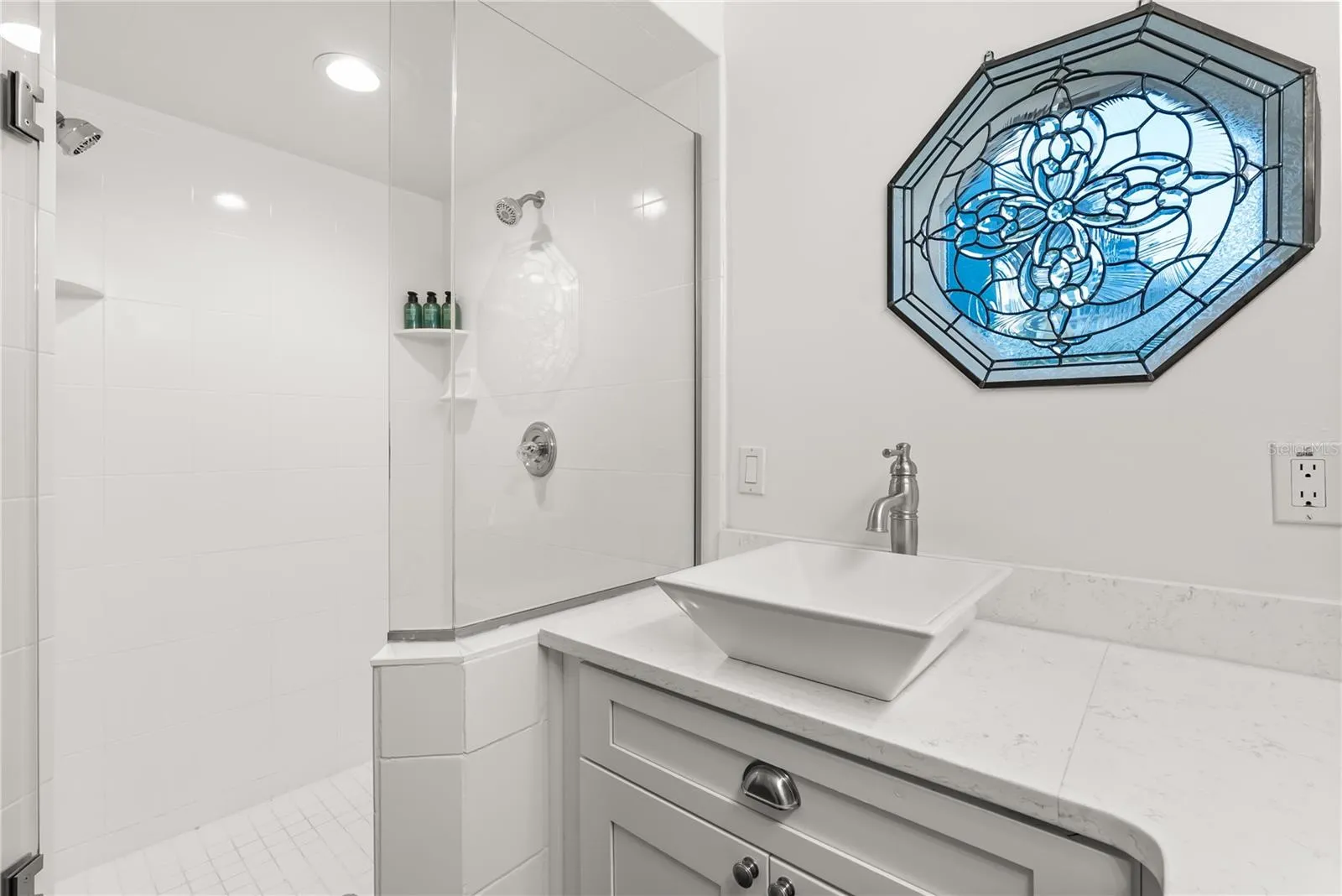 Master ensuite bathroom with updated finishes and statement window and skylight