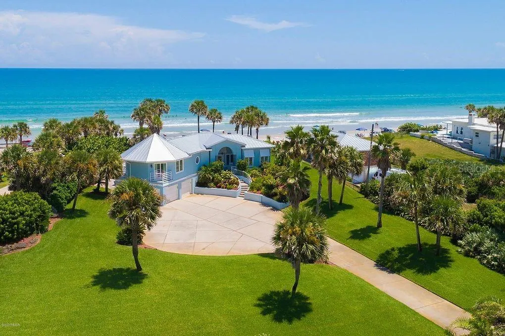 Set on over three-quarters of an acre with approximately 85 feet of ocean frontage, this property offers a generous setback from the road, ample driveway parking, and an attached garage. Neighboring Frank Rendon Park features a playground, covered picnic areas, restrooms, public beach access, and parking