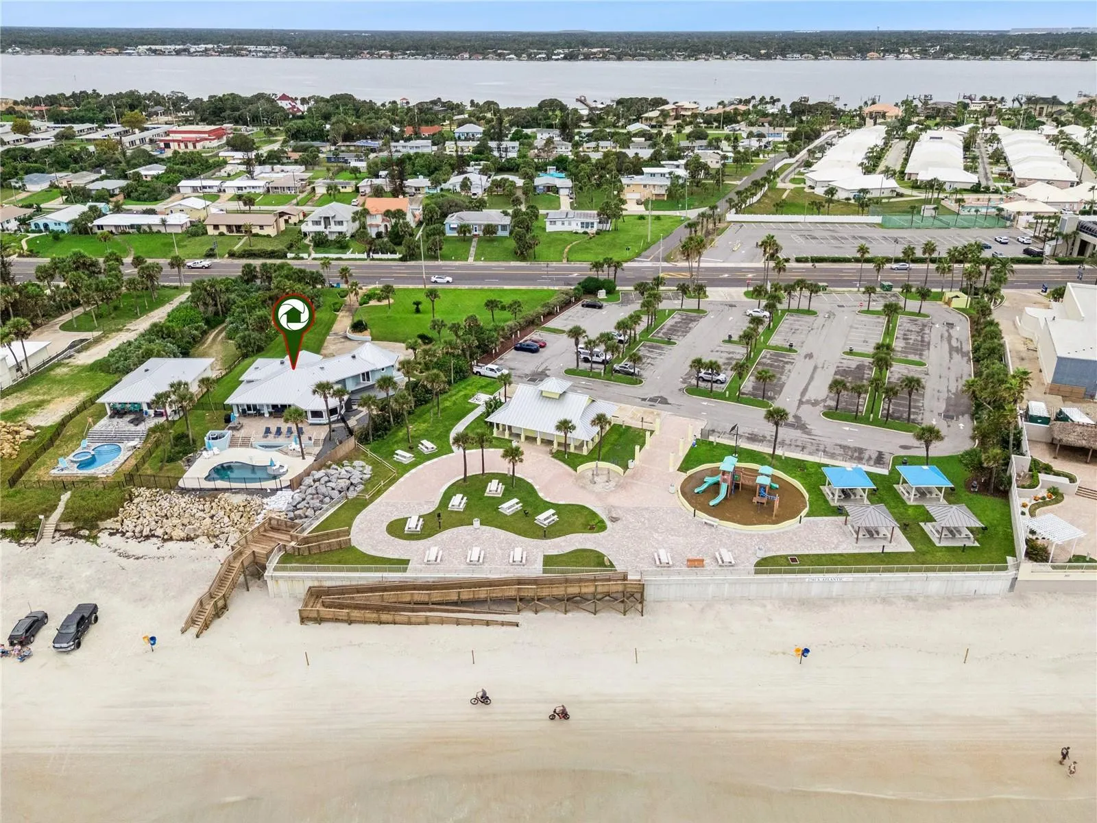 Set on over three-quarters of an acre with approximately 85 feet of ocean frontage, this property offers a generous setback from the road, ample driveway parking, and an attached garage. Neighboring Frank Rendon Park features a playground, covered picnic areas, restrooms, public beach access, and parking