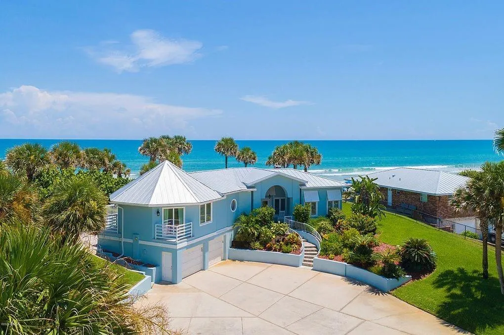 Set on over three-quarters of an acre with approximately 85 feet of ocean frontage, this property offers a generous setback from the road, ample driveway parking, and an attached garage. Neighboring Frank Rendon Park features a playground, covered picnic areas, restrooms, public beach access, and parking