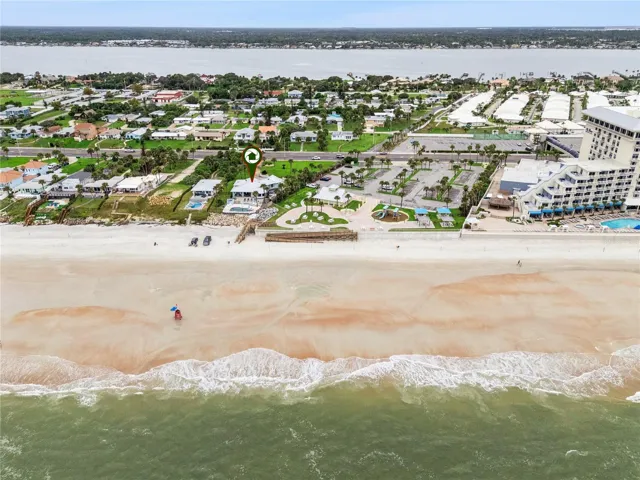 Set on over three-quarters of an acre with approximately 85 feet of ocean frontage, this property offers a generous setback from the road, ample driveway parking, and an attached garage. Neighboring Frank Rendon Park features a playground, covered picnic areas, restrooms, public beach access, and parking.