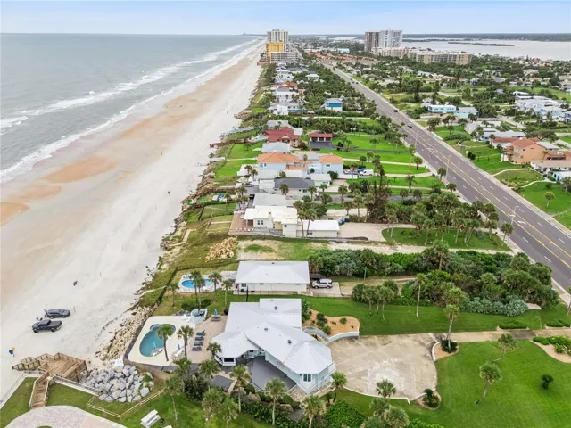 Set on over three-quarters of an acre with approximately 85 feet of ocean frontage, this property offers a generous setback from the road, ample driveway parking, and an attached garage. Neighboring Frank Rendon Park features a playground, covered picnic areas, restrooms, public beach access, and parking.
