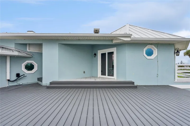 Newly added composite decking located directly off the master bedroom to enjoy ocean views with your morning coffee.
