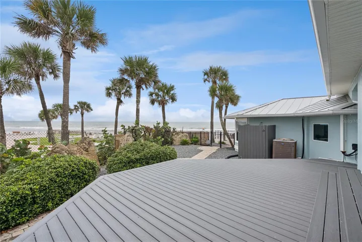 Newly added composite decking located directly off the master bedroom to enjoy ocean views with your morning coffee.