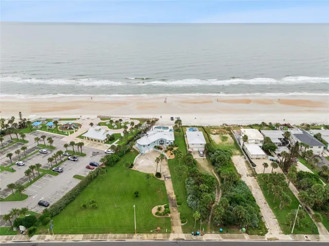 Set on over three-quarters of an acre with approximately 85 feet of ocean frontage, this property offers a generous setback from the road, ample driveway parking, and an attached garage. Neighboring Frank Rendon Park features a playground, covered picnic areas, restrooms, public beach access, and parking.