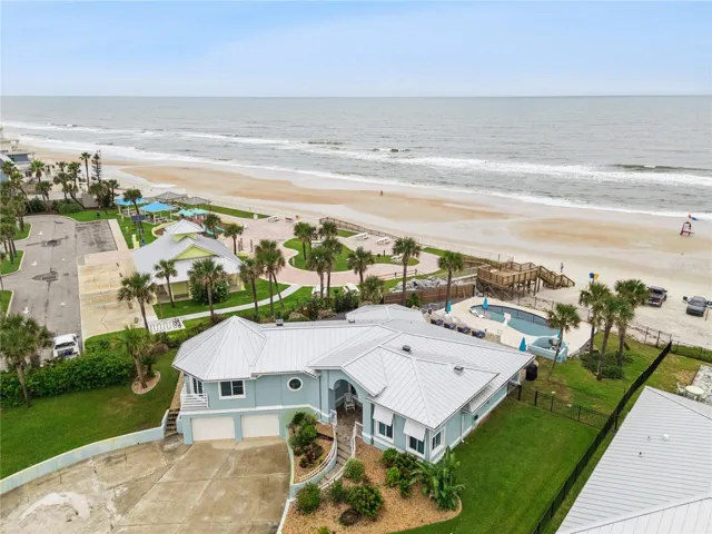 Set on over three-quarters of an acre with approximately 85 feet of ocean frontage, this property offers a generous setback from the road, ample driveway parking, and an attached garage. Neighboring Frank Rendon Park features a playground, covered picnic areas, restrooms, public beach access, and parking.
