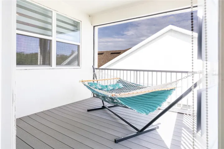 Covered upstairs balcony overlooking a conservation area, ideal for relaxing.
