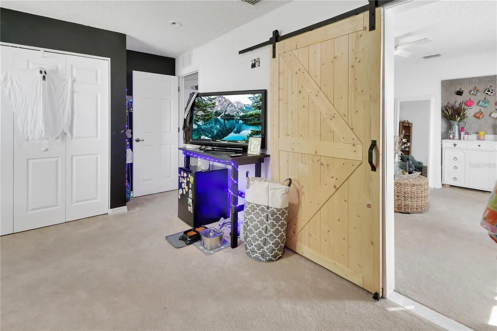 Bedroom 4 has a barn door leading to middle bedroom/family room.