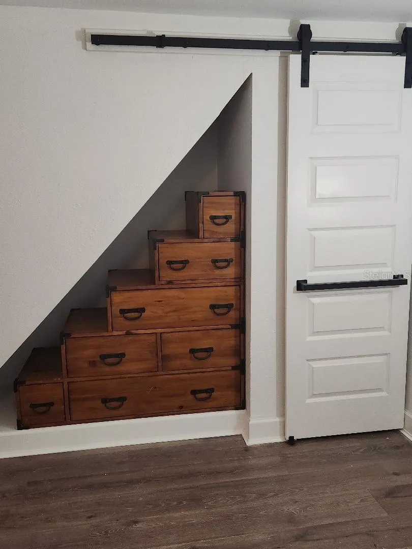 Tansu  Step Bureau and Barn Door closet in Bedroom Creative use of space and storage.