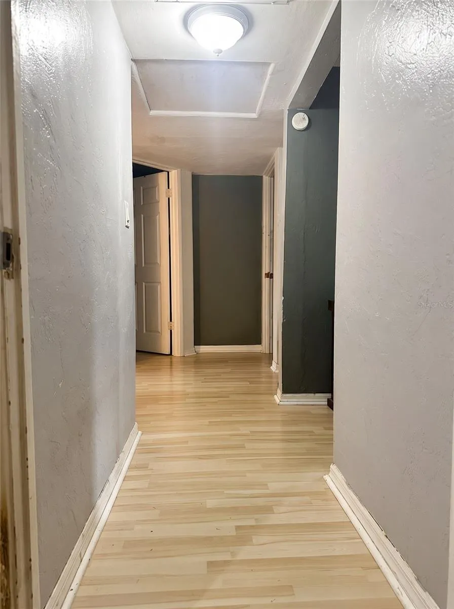 HALLWAY VIEW FROM PRIMARY BEDROOM