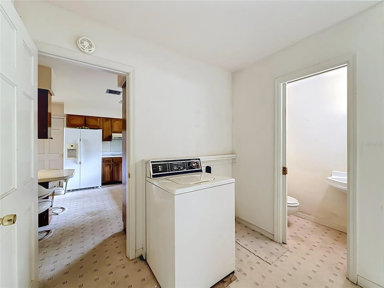 Kitchen to Laundry Room and Half Bathroom