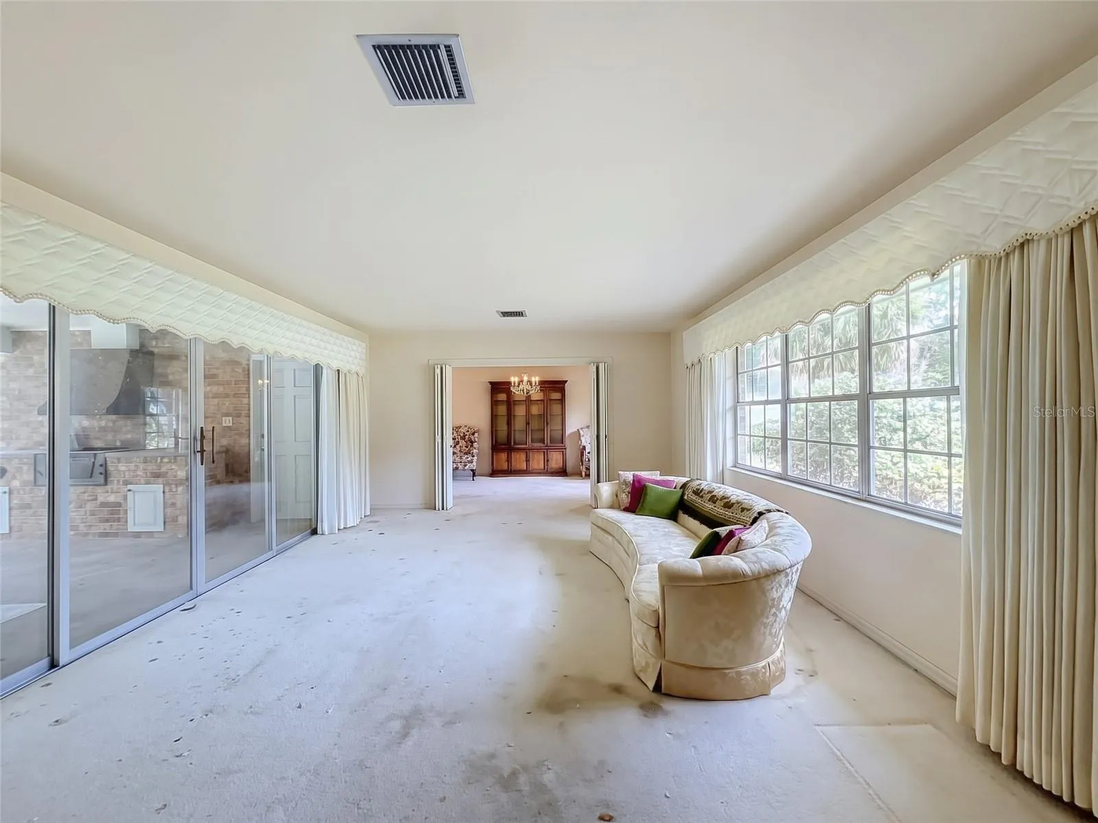 Living Room with Sliding Glass Doors to Pool