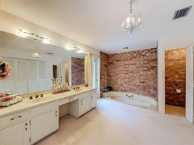 Primary Bathroom - Dual Sinks - Garden Tub - Private Water Closet - Door next to Tub