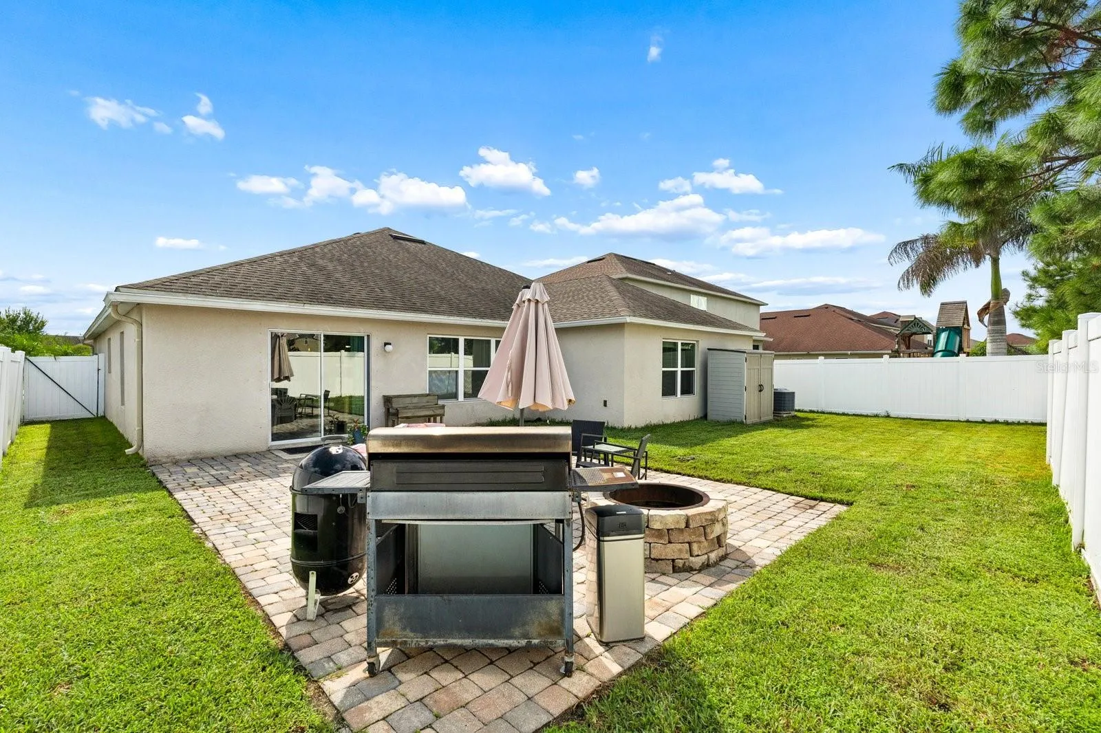 Pavered patio area with built in fire pit