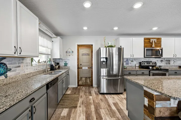 Door to laundry room, through to two car garage
