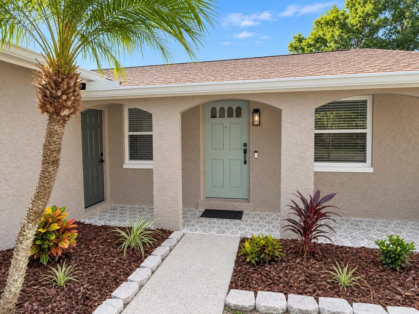 Front porch with mosaic tile flooring