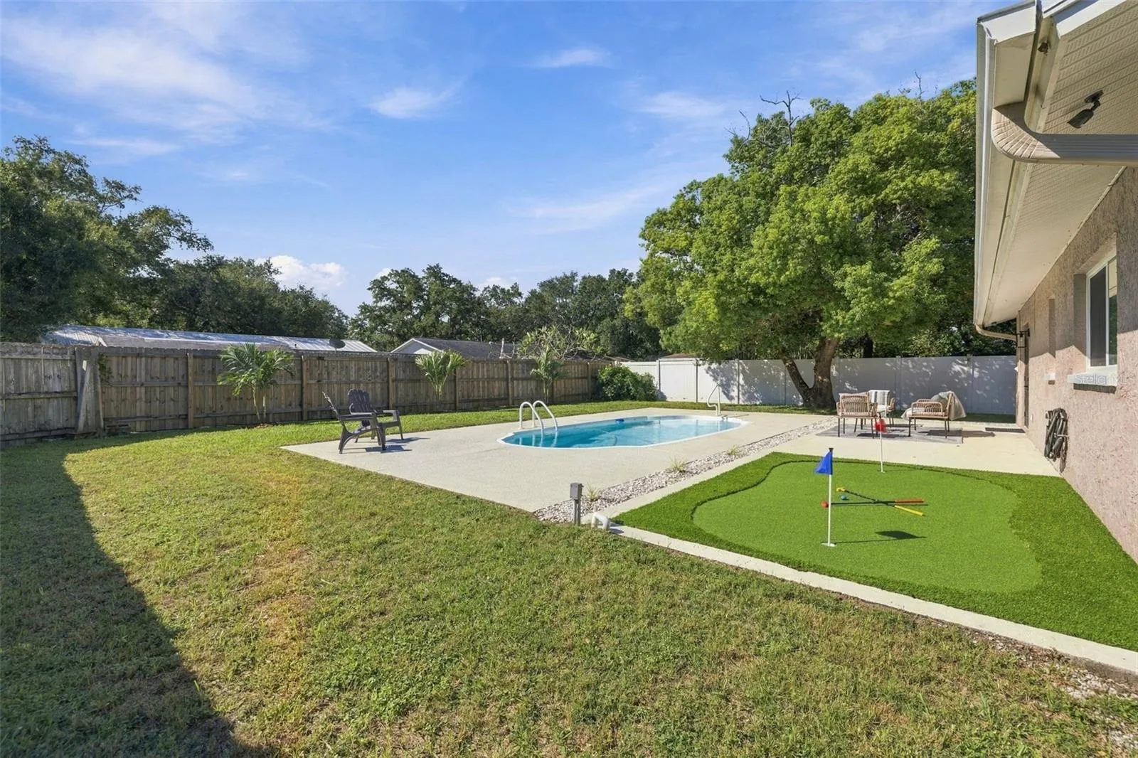 Putting Green and large fenced backyard